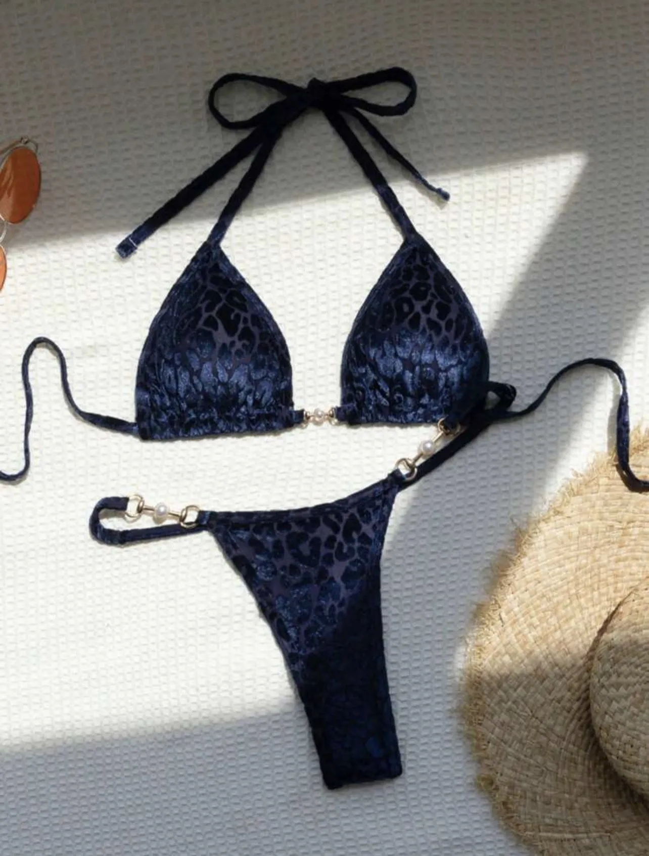Women's blue leopard print T-shaped swimwear bikini set made from polyester and spandex fabric.