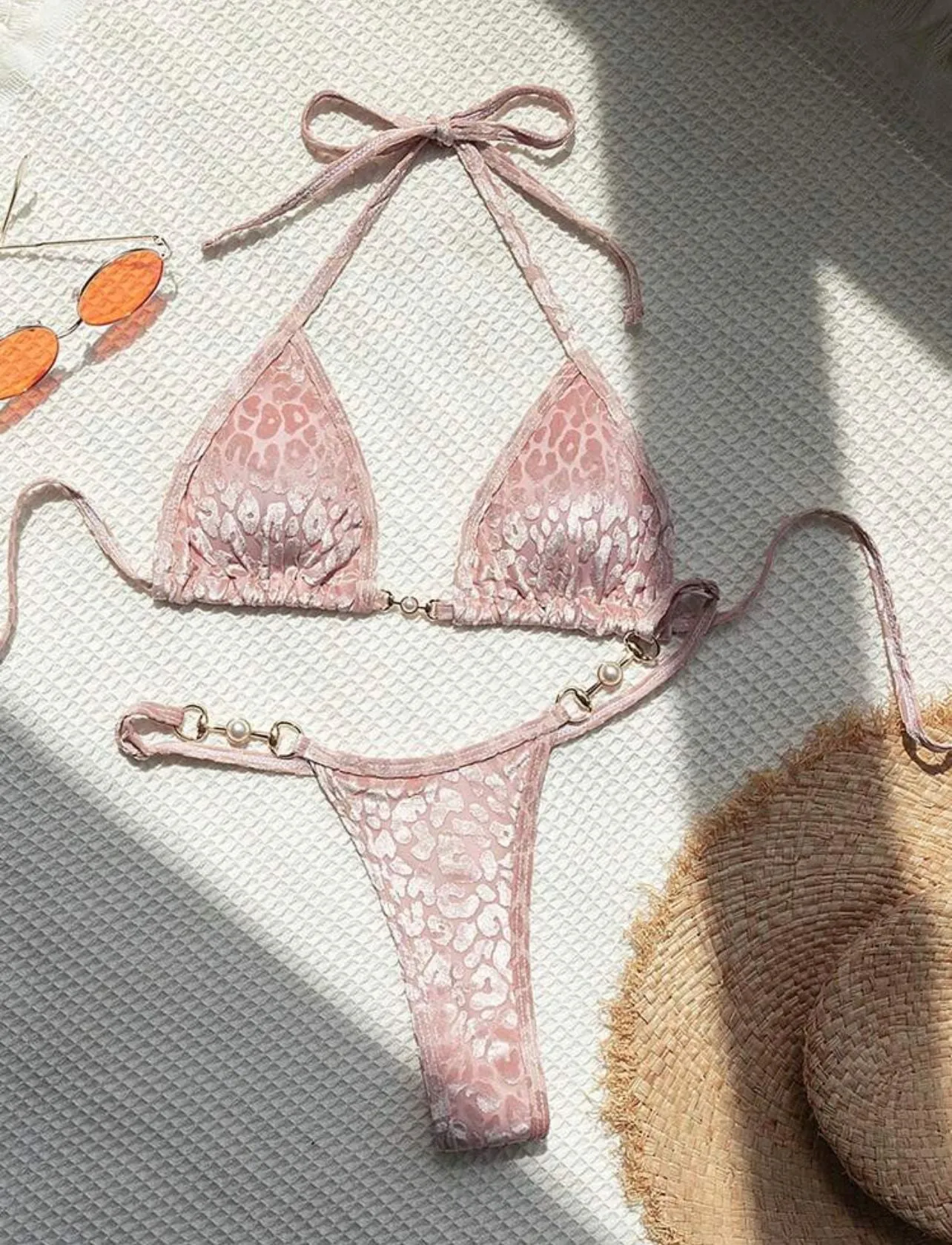 Women's blue leopard print T-shaped swimwear bikini set made from polyester and spandex fabric.
