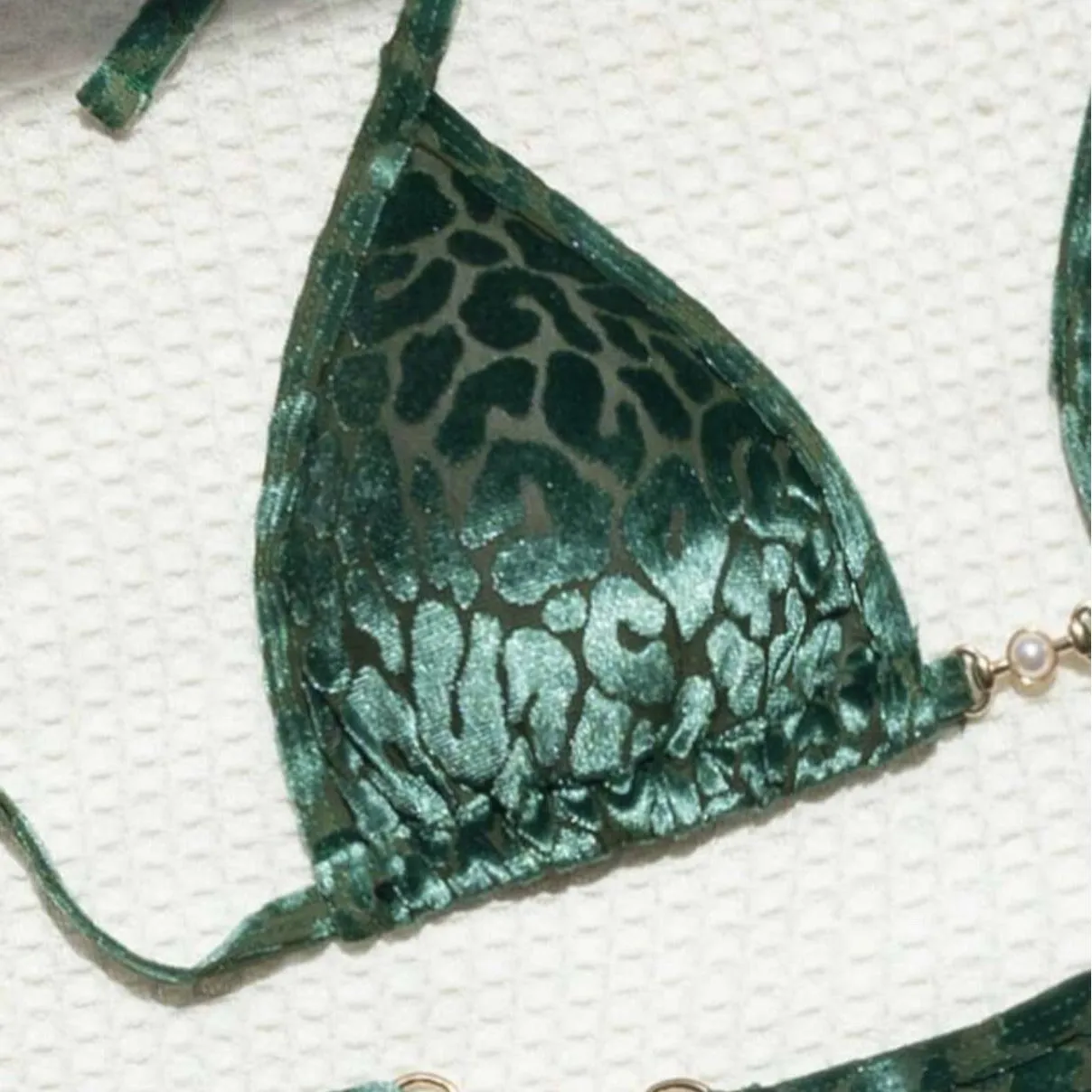Women's blue leopard print T-shaped swimwear bikini set made from polyester and spandex fabric.