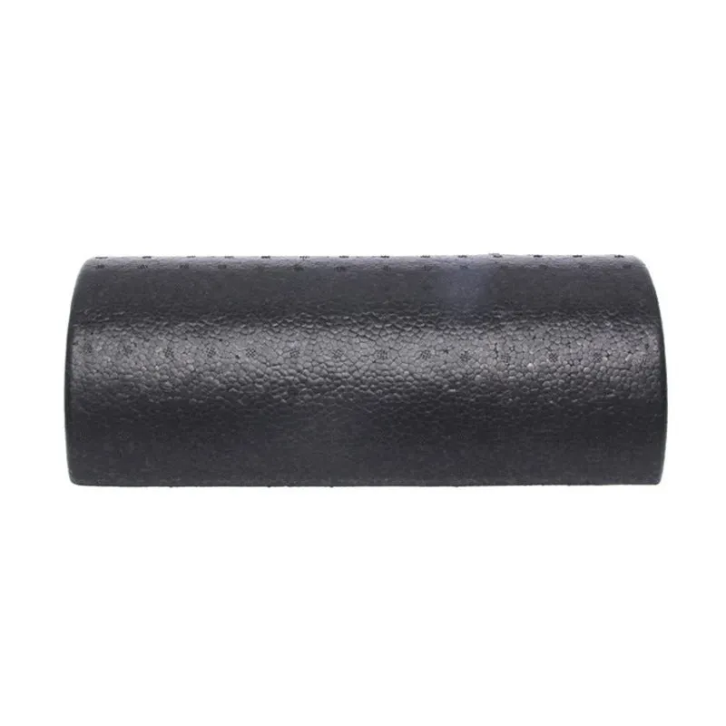 Black semi-circular EPP foam yoga roller 30cm on floor for muscle massage and stretching
