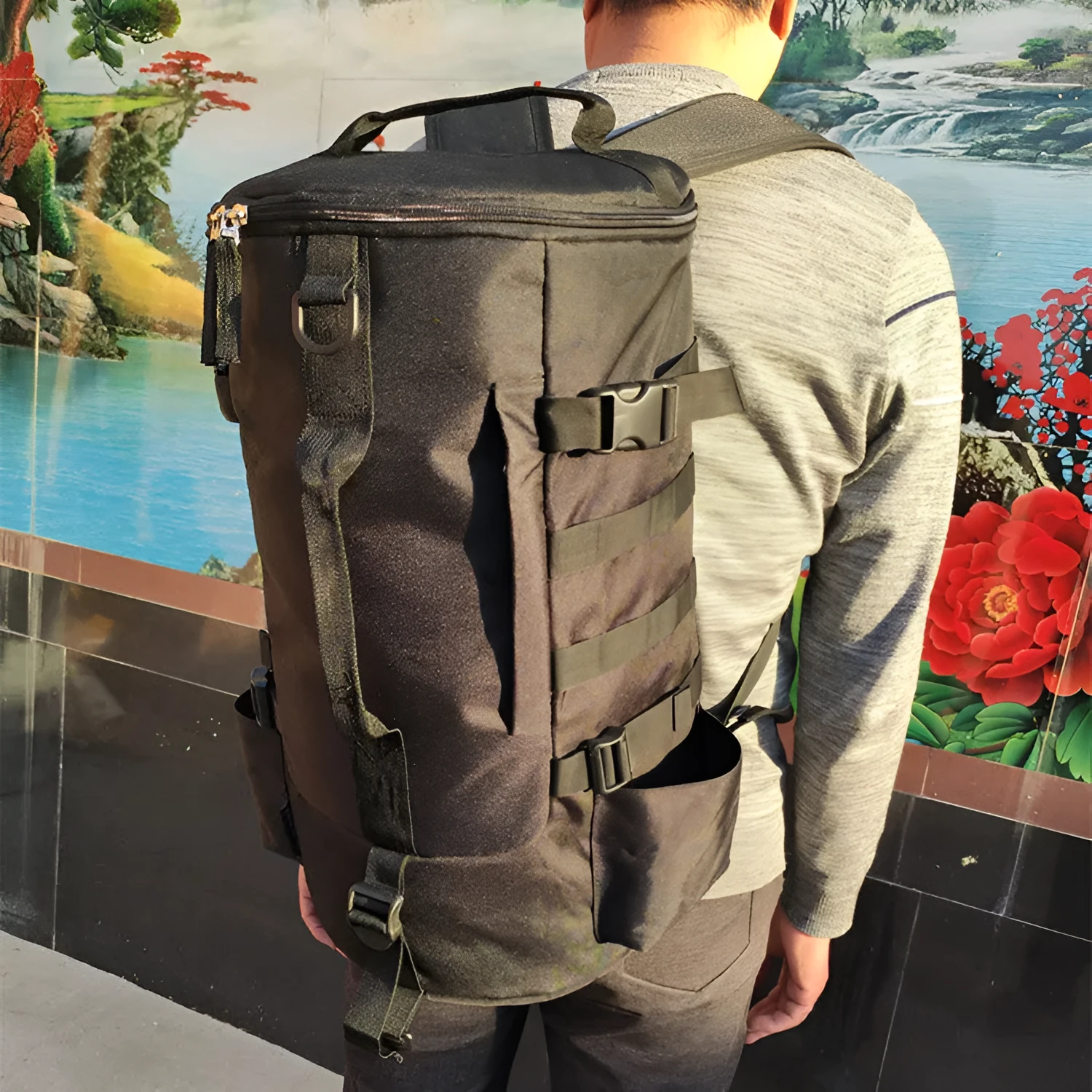 Outdoor cylindrical fishing gear backpack in black, 36-55L capacity, polyester fabric, 45x26x26cm