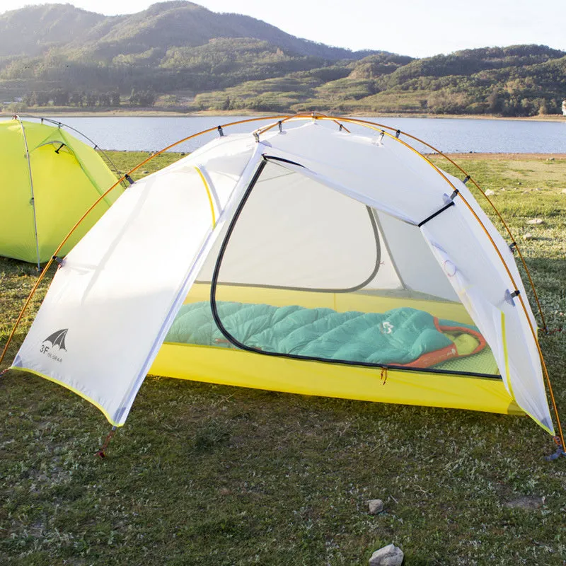 Green camouflage double layer camping tent with two room one hall layout set up outdoors