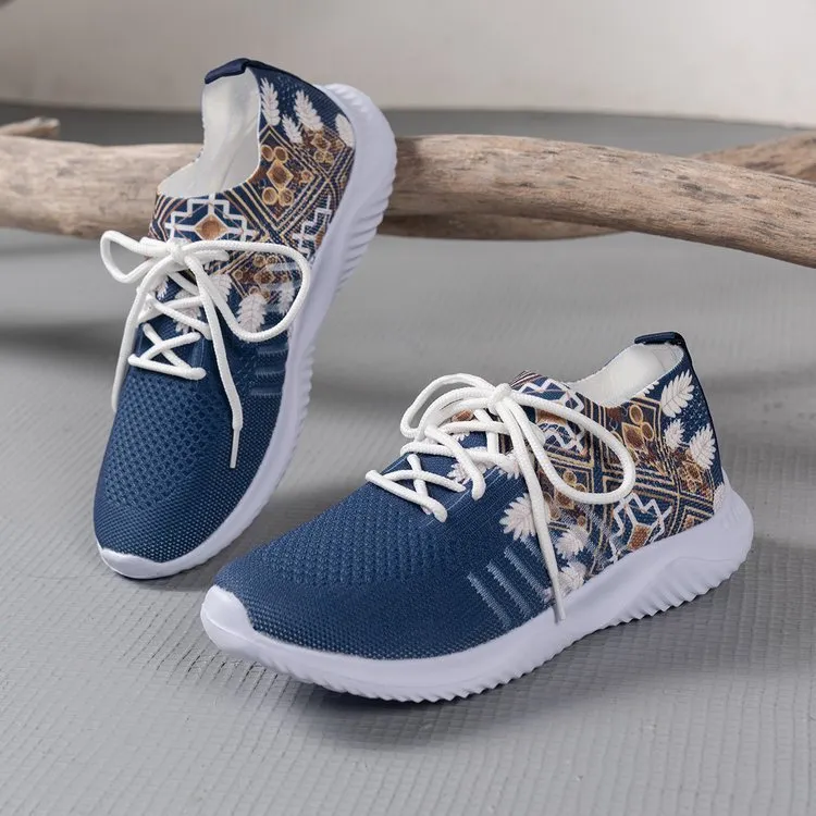 Women's woven flat shoes in green with printed totem detail, mesh upper, rubber sole, and front lace-up closure