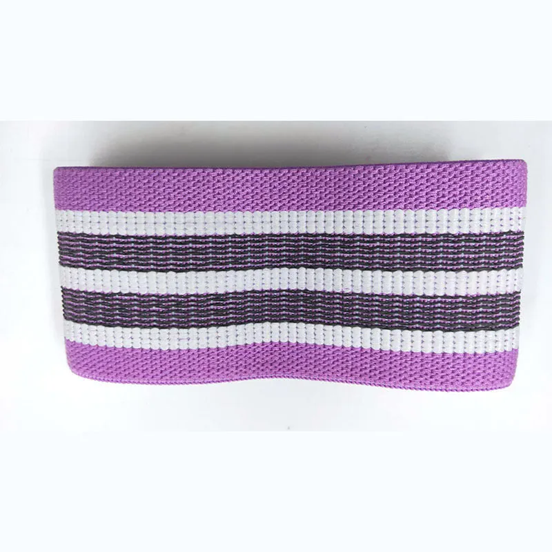 Fabric resistance band on a blue background showing two different colours for glute and yoga training