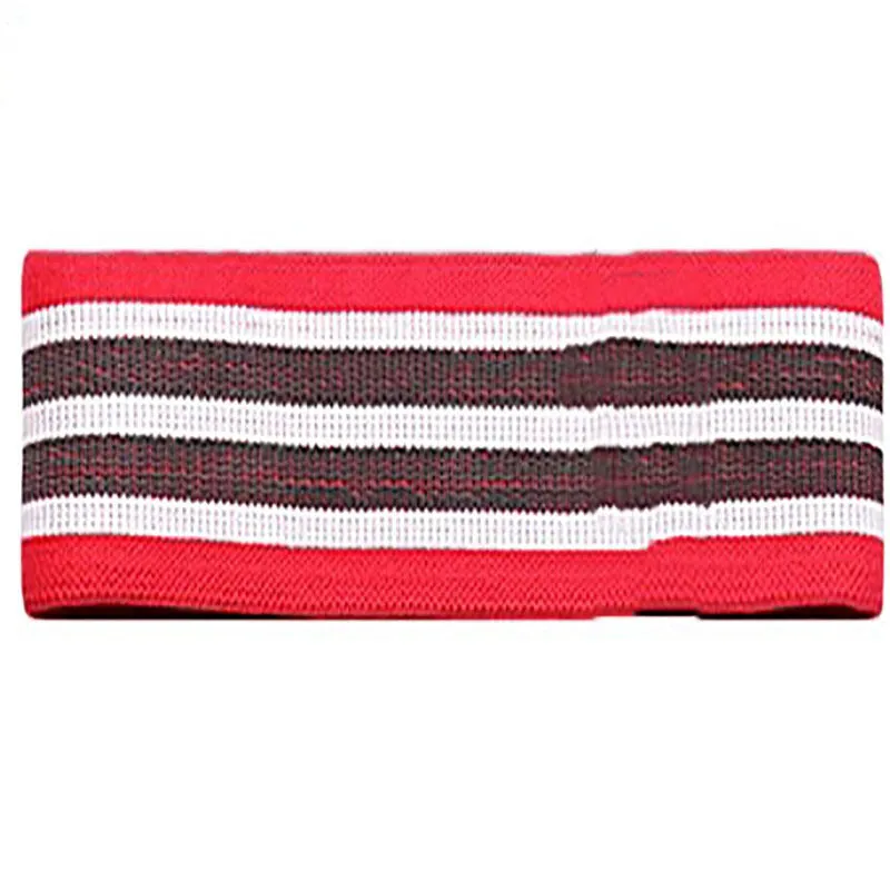 Fabric resistance band on a blue background showing two different colours for glute and yoga training