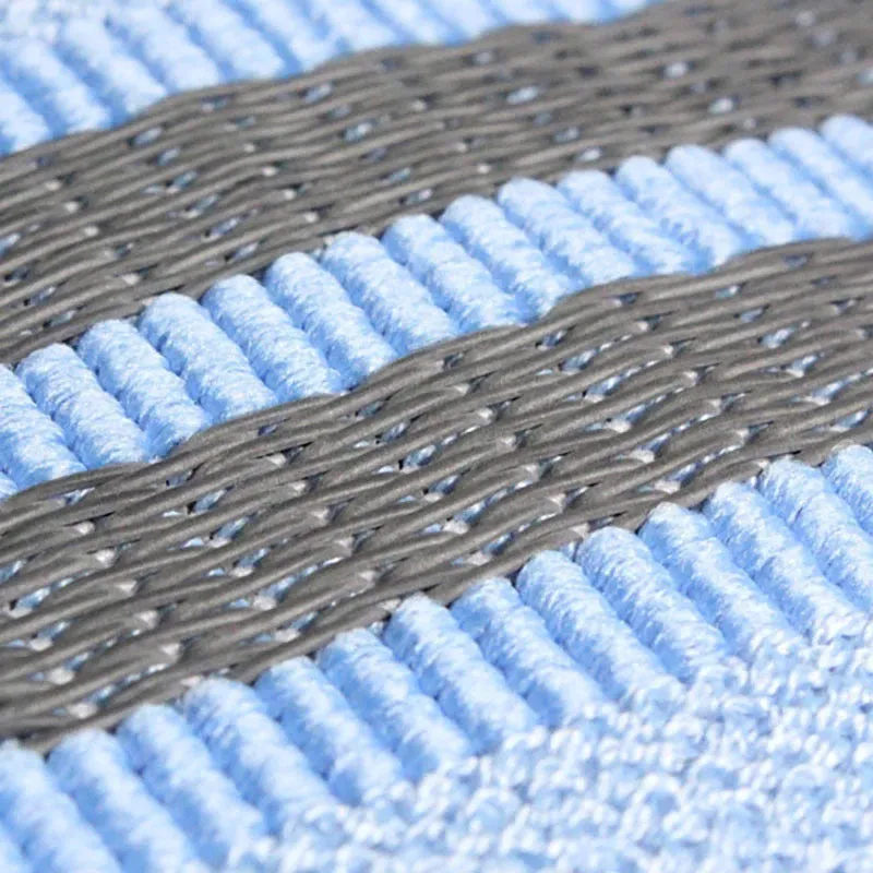 Fabric resistance band on a blue background showing two different colours for glute and yoga training