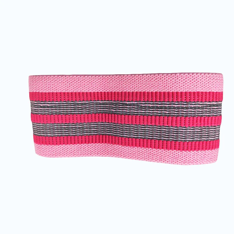 Fabric resistance band on a blue background showing two different colours for glute and yoga training