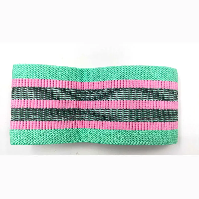 Fabric resistance band on a blue background showing two different colours for glute and yoga training