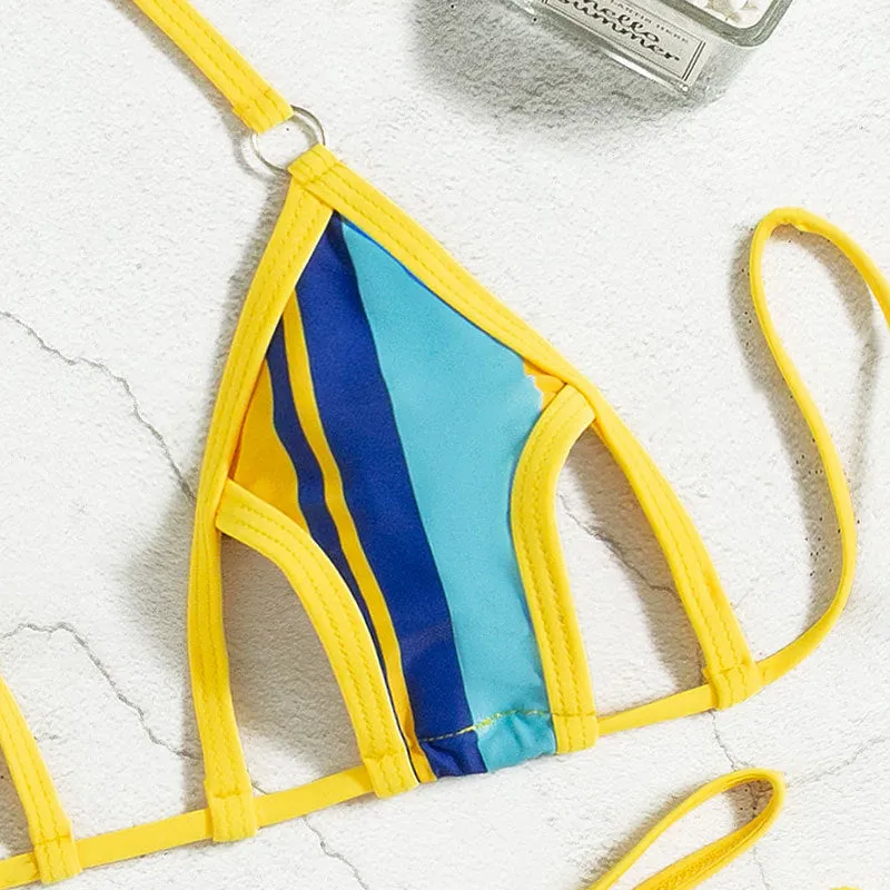 Yellow women's split swimsuit with neck-hanging design, high-waisted shorts, and sleeveless backless top