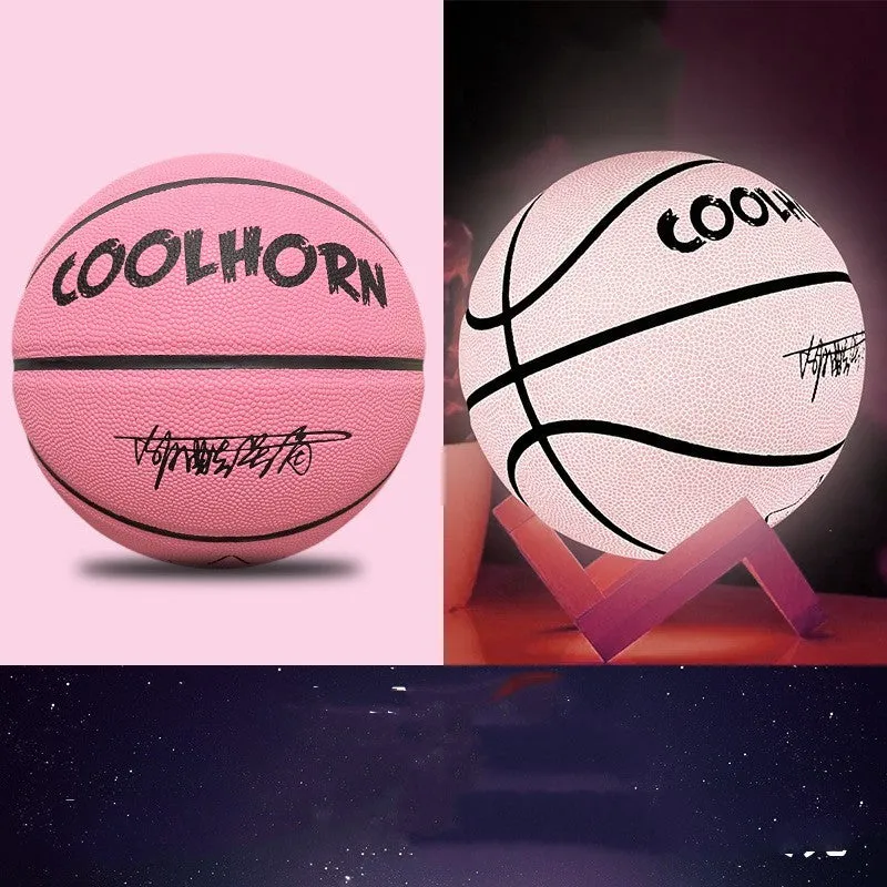 Luminous outdoor basketball with soft PU leather cover in glowing blue colour on outdoor court
