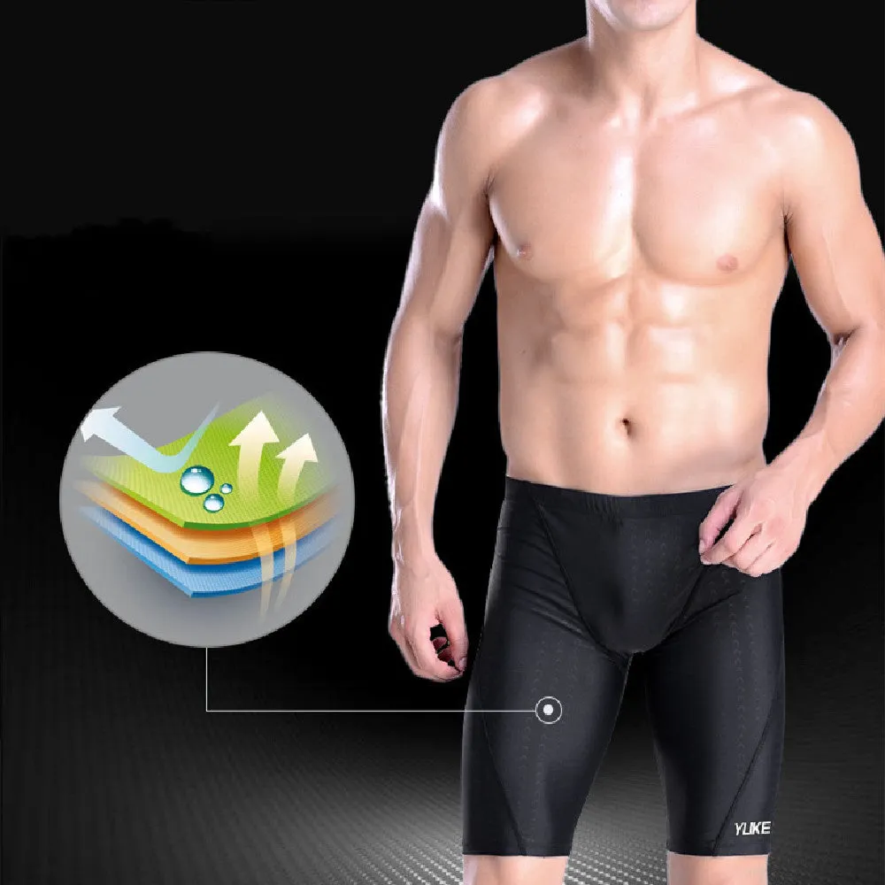 Men's black swimming set with briefs, goggles, cap, ear plugs, nose clip, and a carry bag laid out.