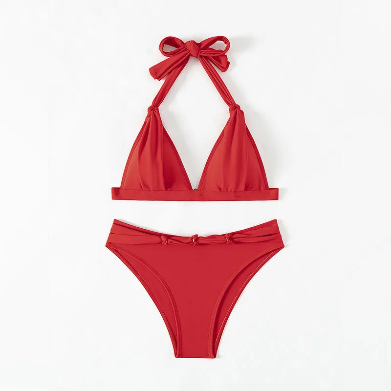 Red women's lace-up halterneck bikini set with matching shorts