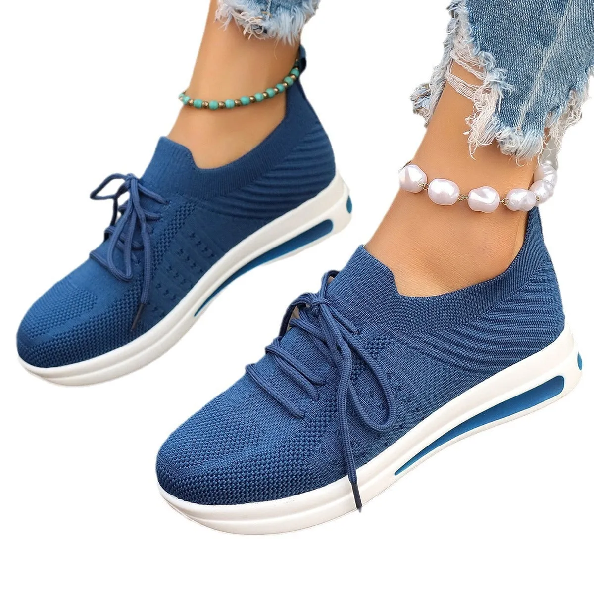 Women's low-top casual sneakers in artificial PU with lace-up front and round toe