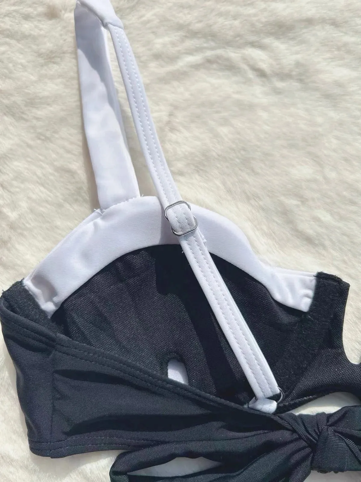 Black women's low waist bikini swimsuit with stitching split detail on brief style