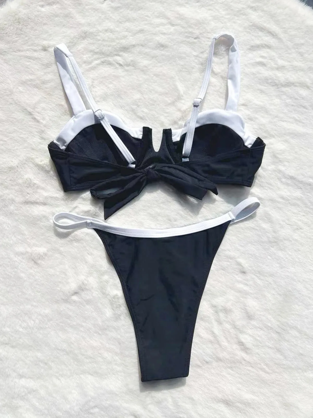Black women's low waist bikini swimsuit with stitching split detail on brief style