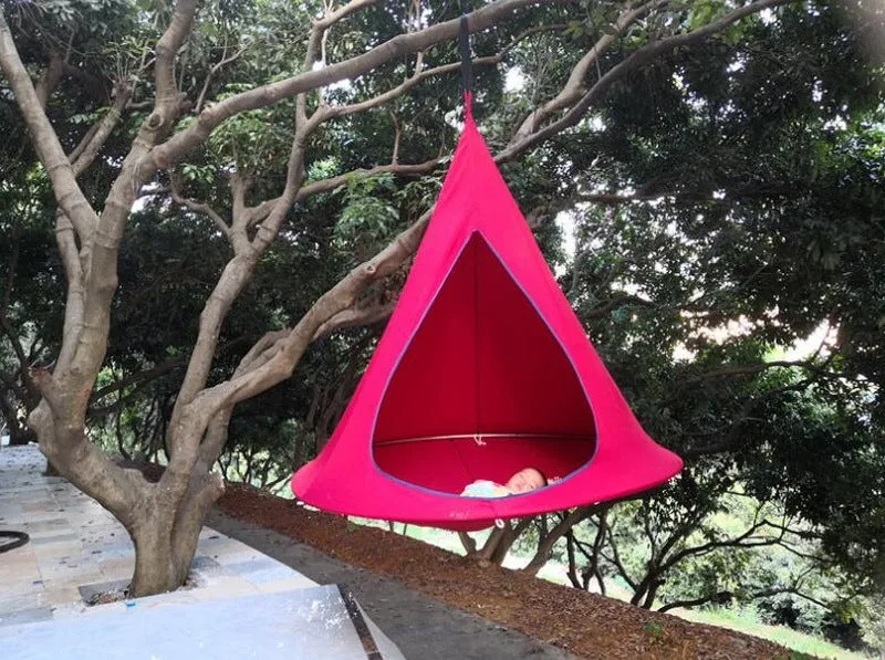 Lightweight portable flying saucer hammock in green oxford cloth with metal frame for camping and outdoor leisure