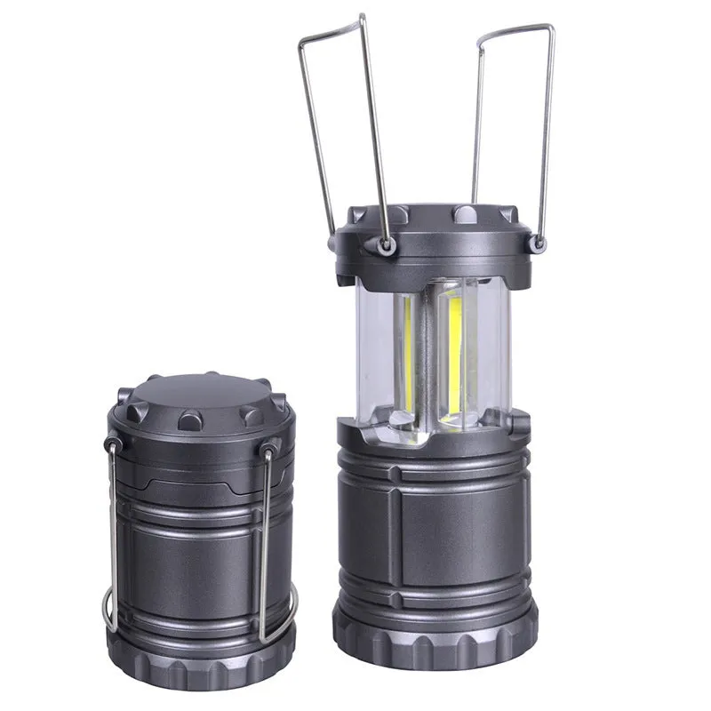 Multifunctional COB camping lantern in gold with solar panel, telescopic body, and stainless steel fold-away handles