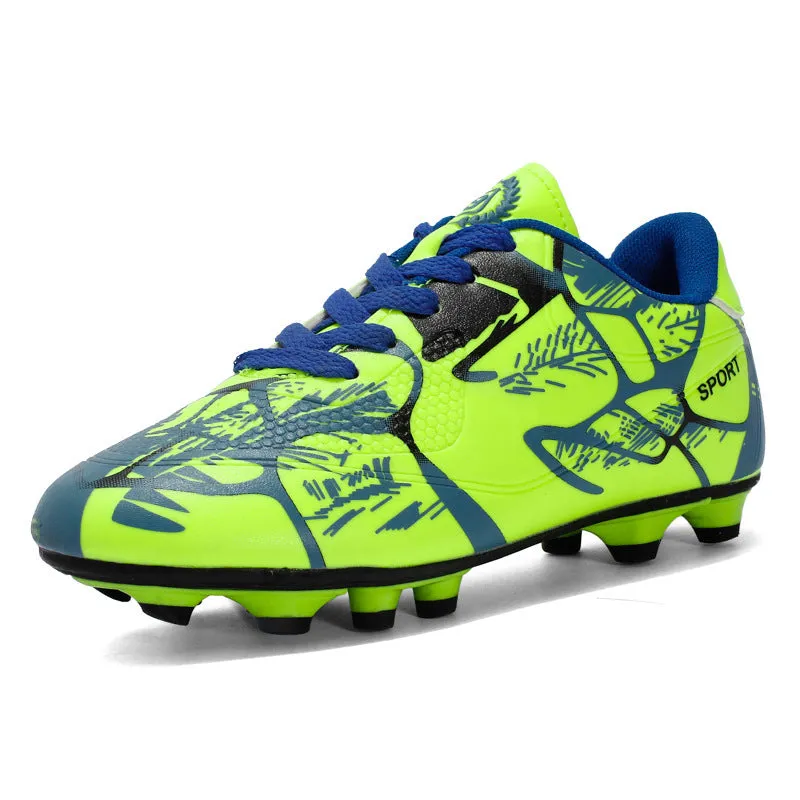 Red low-top soccer shoes with synthetic leather upper and spike outsole on natural grass