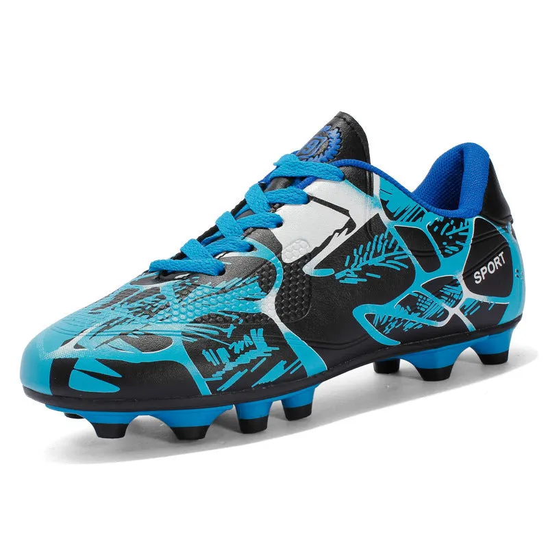 Red low-top soccer shoes with synthetic leather upper and spike outsole on natural grass