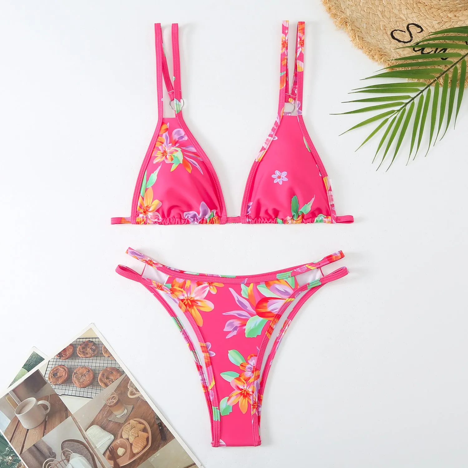 Women's floral printed halterneck bikini set in blue on a mannequin