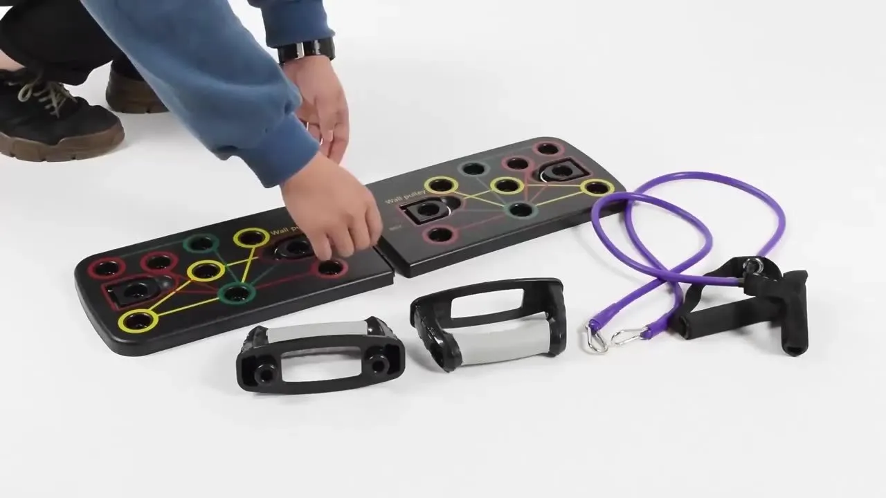 Multifunctional push-up folding board with pull rope combination bracket on a floor