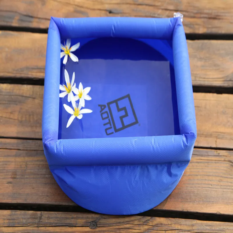Outdoor folding washbasin bucket, plastic, 30cm diameter, available in blue and green, folded flat view