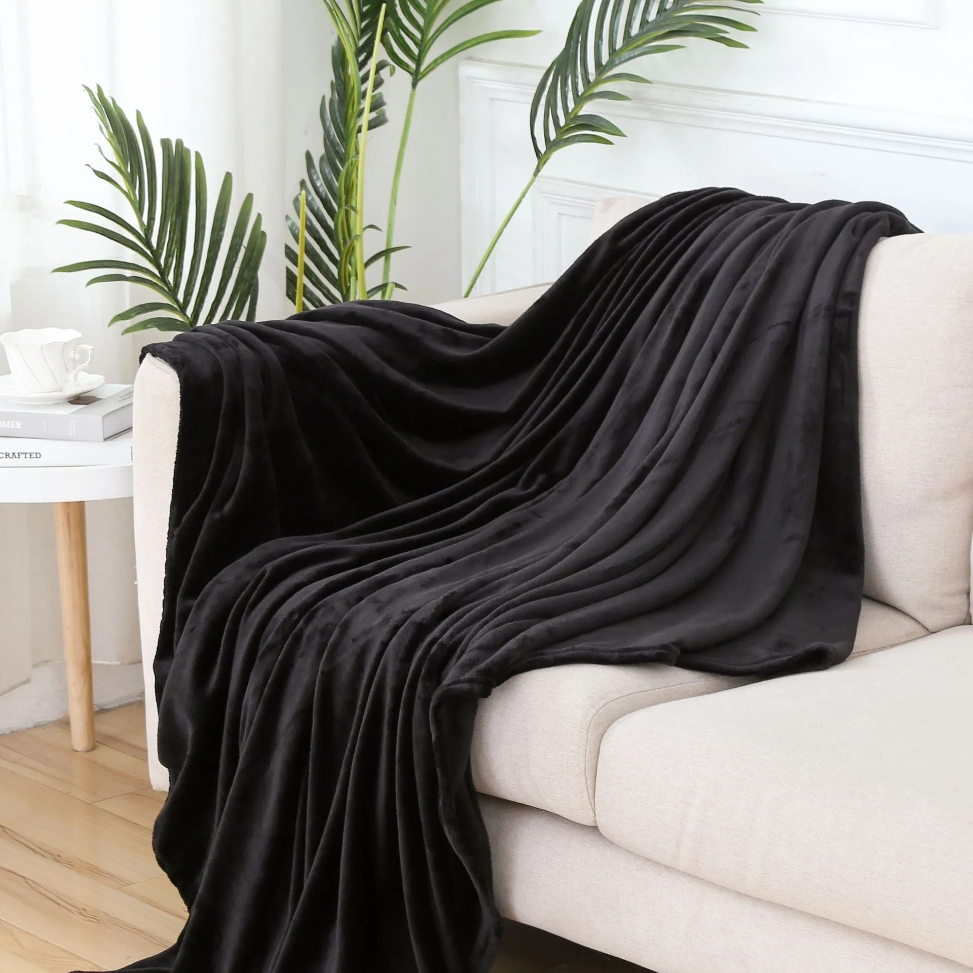 Solid colour polyester flannel blanket in big red, lying flat on a surface