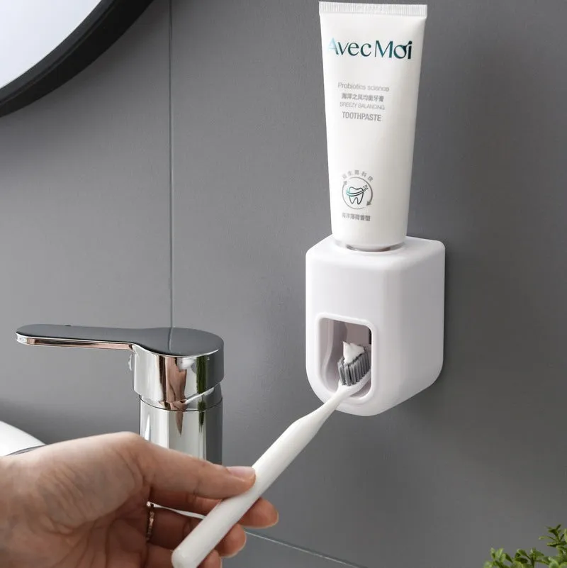 Nordic automatic toothpaste dispenser wall mounted in pink colour with compact 9x6x6cm design