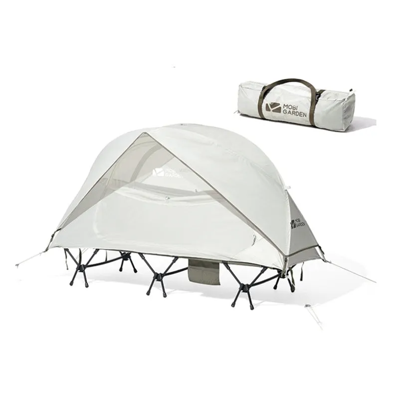 Ultra-light folding white single tent with aluminium poles on grass, 2.4kg