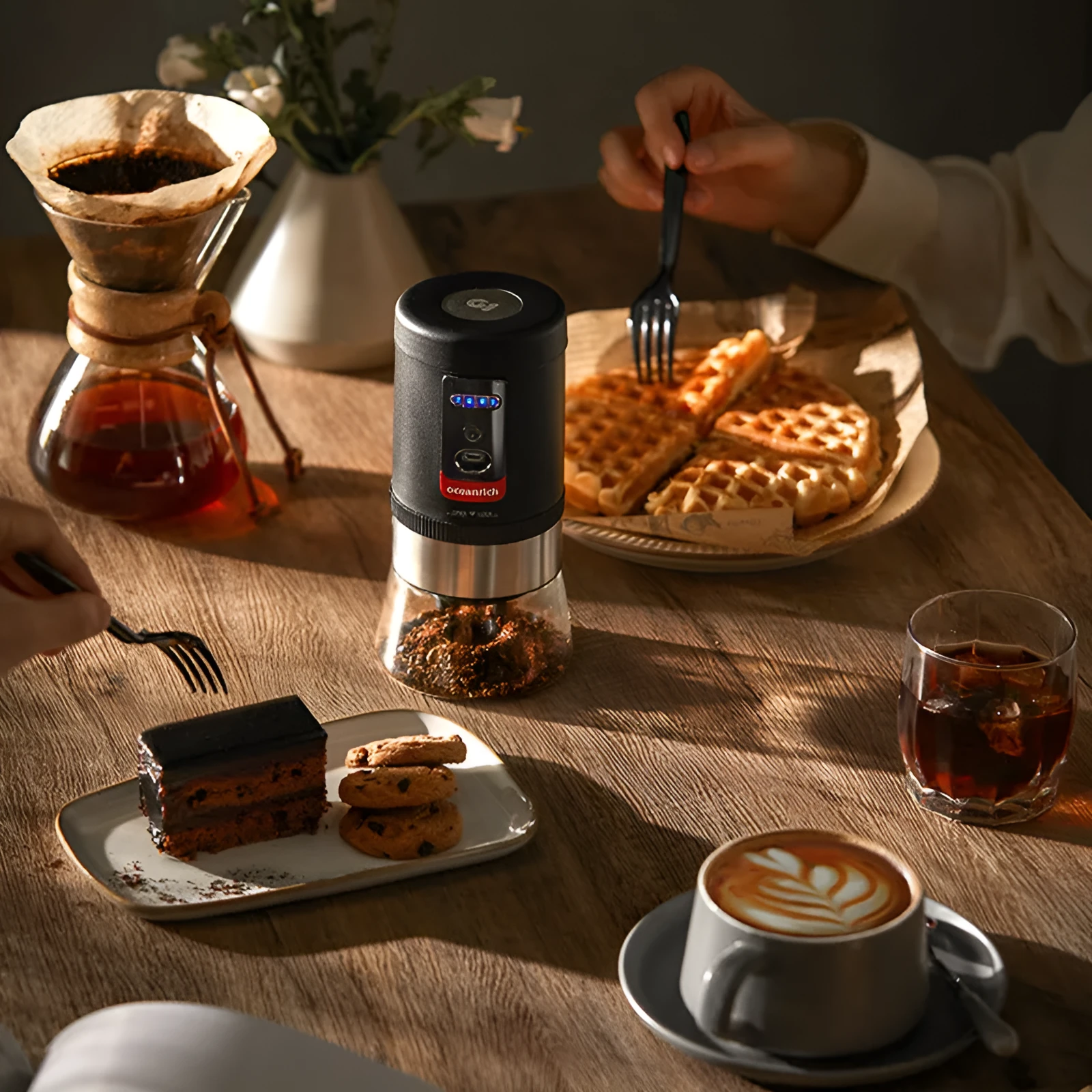 Portable black hand crank coffee grinder with manual operation for travel and home use