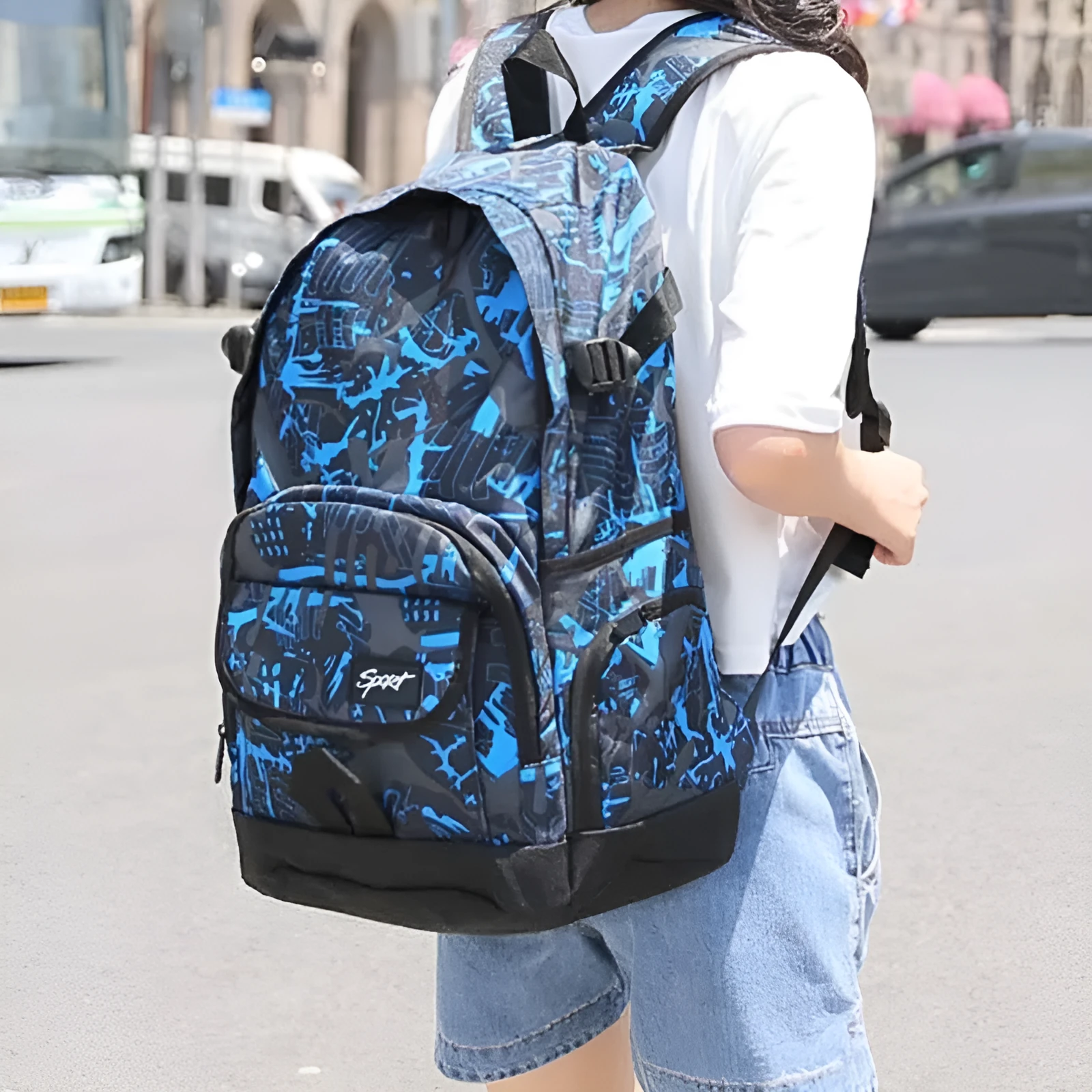 Blue and red classic nylon backpack with large main compartment and adjustable shoulder straps.