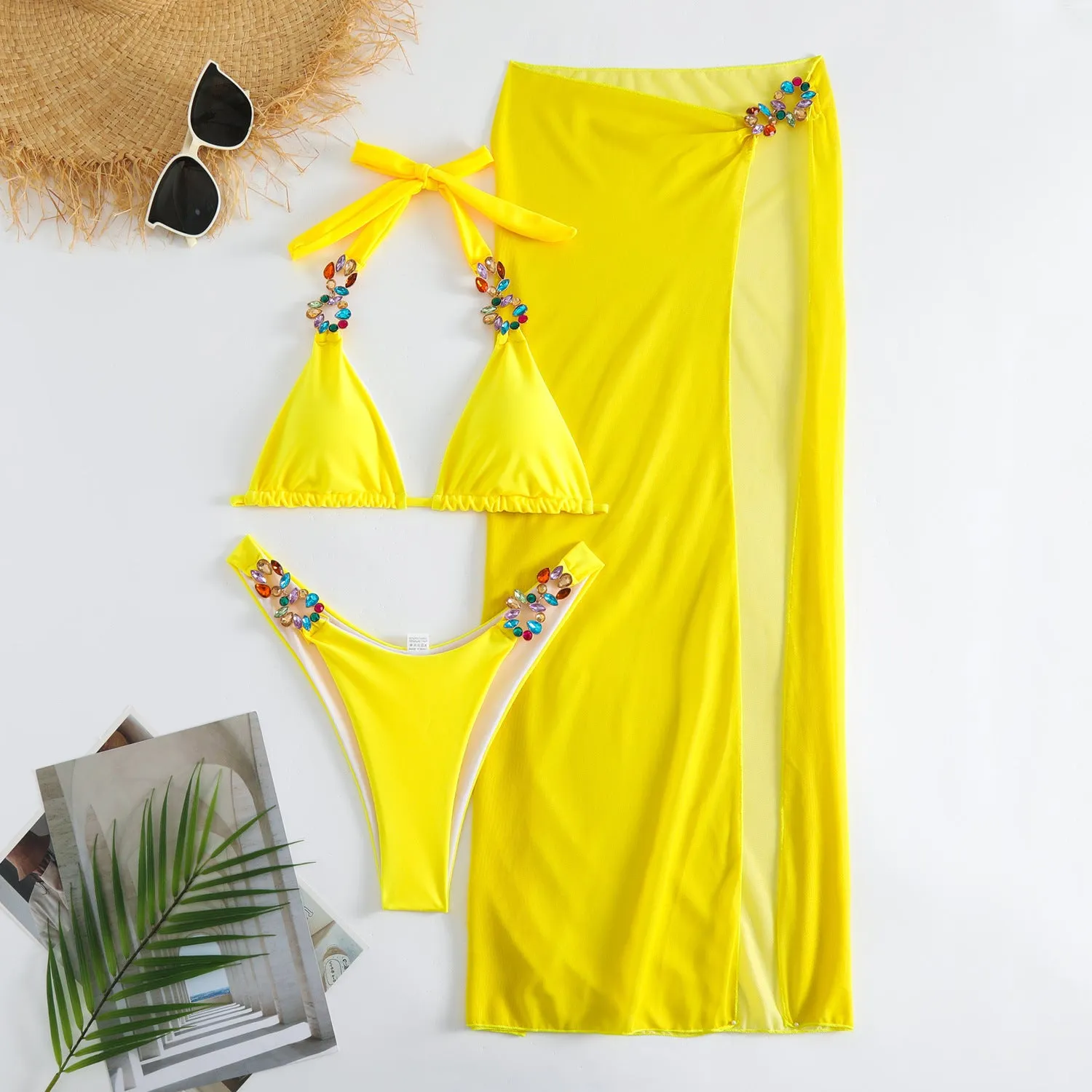 Women's rose red three-piece bikini set with long mesh skirt for swimming.