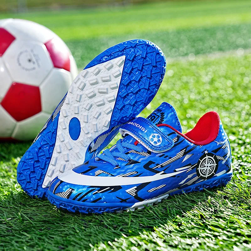 Children's football shoes with Velcro fastening, non-slip rubber outsole, and spikes in sky blue colour, low-top design