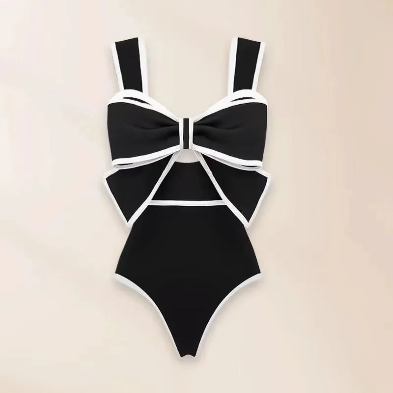 Women's one-piece swimsuit with beach dress style skirt and bow detail in polyester fabric