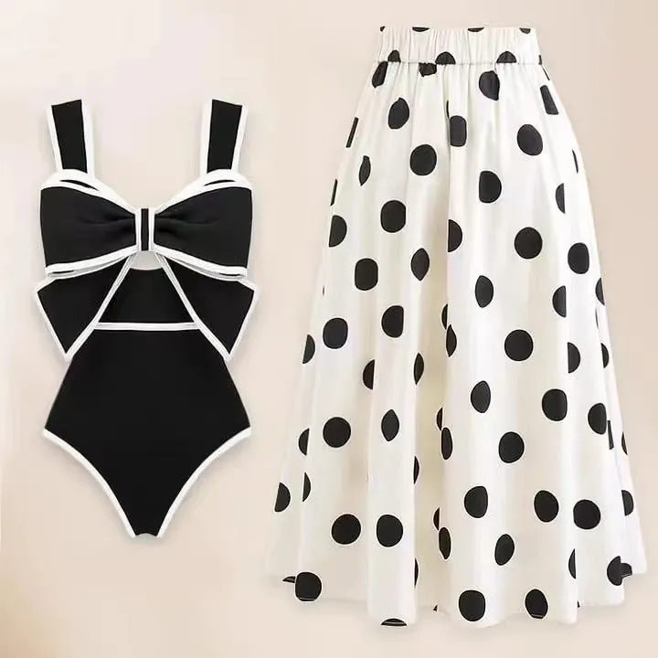 Women's one-piece swimsuit with beach dress style skirt and bow detail in polyester fabric