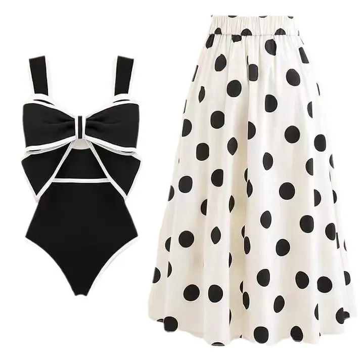 Women's one-piece swimsuit with beach dress style skirt and bow detail in polyester fabric