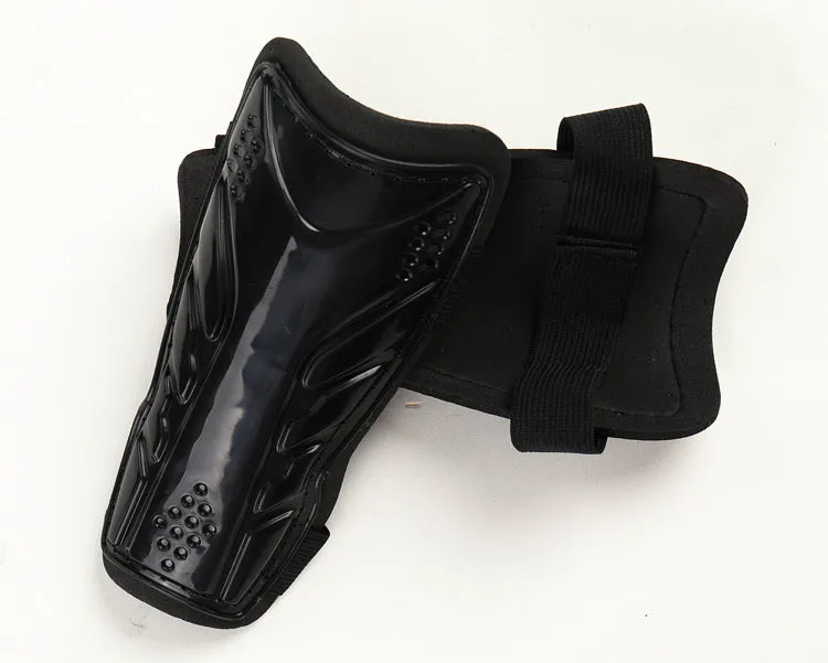Football leggings with single bandage leg guard in black, showing outer plastic plating and soft foam inner