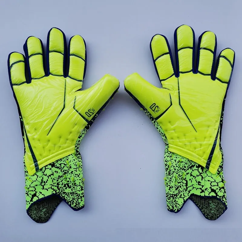 Childrens rubber goalkeeper training gloves in red, black, green and orange on green grass