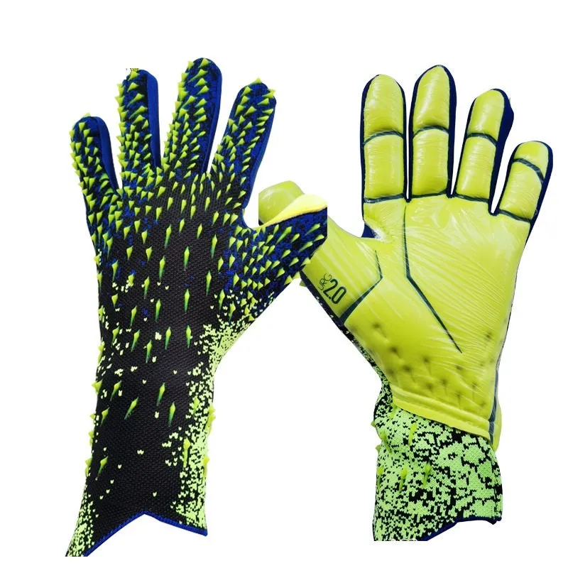 Childrens rubber goalkeeper training gloves in red, black, green and orange on green grass