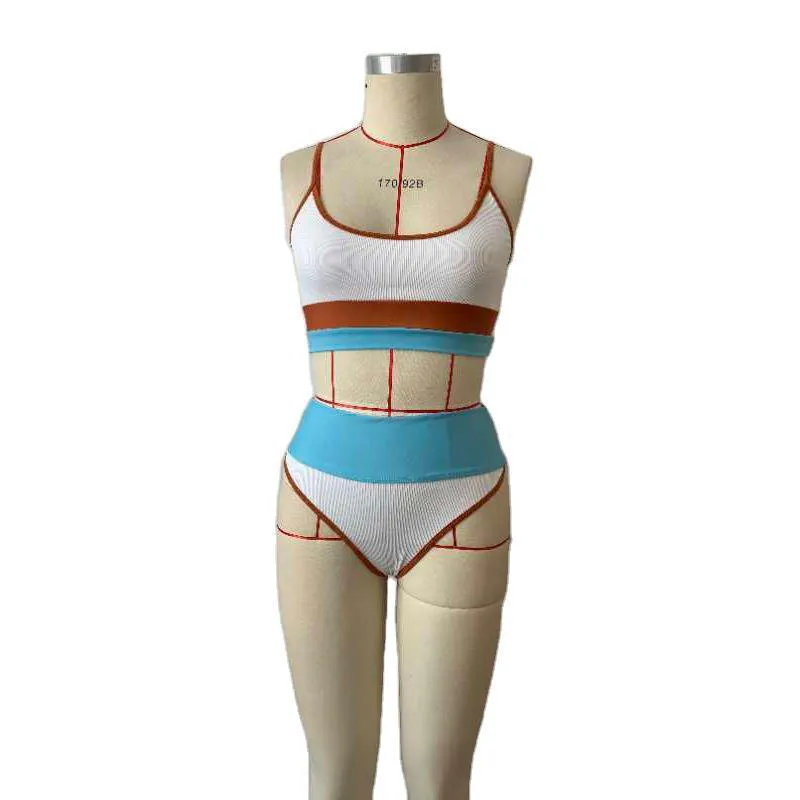Women's solid colour quick-drying swimsuit set with top and shorts.