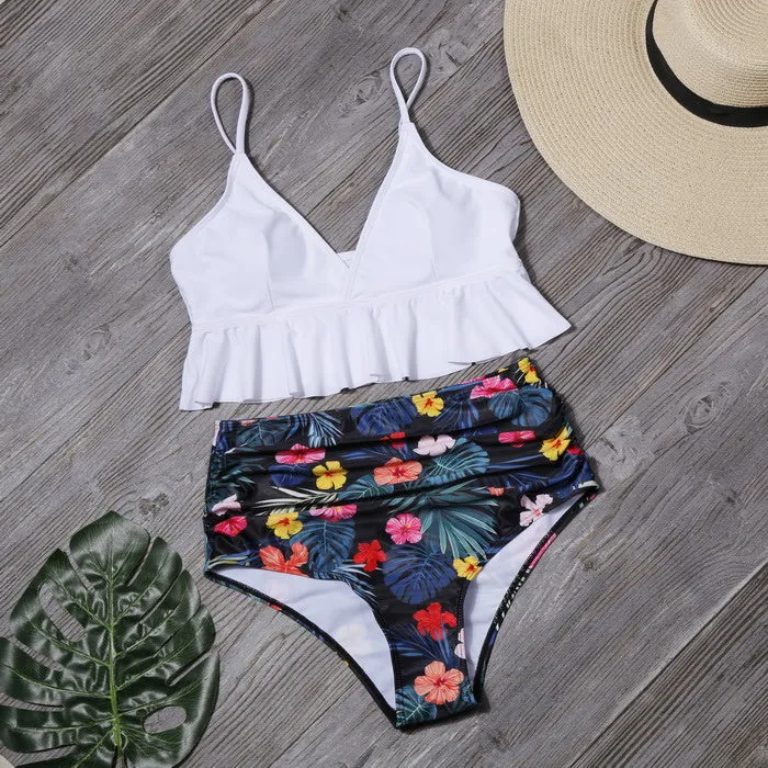 Ruffled nylon swimsuit with steel support and floral lotus print in red, showing ruffled neckline and built-in pads