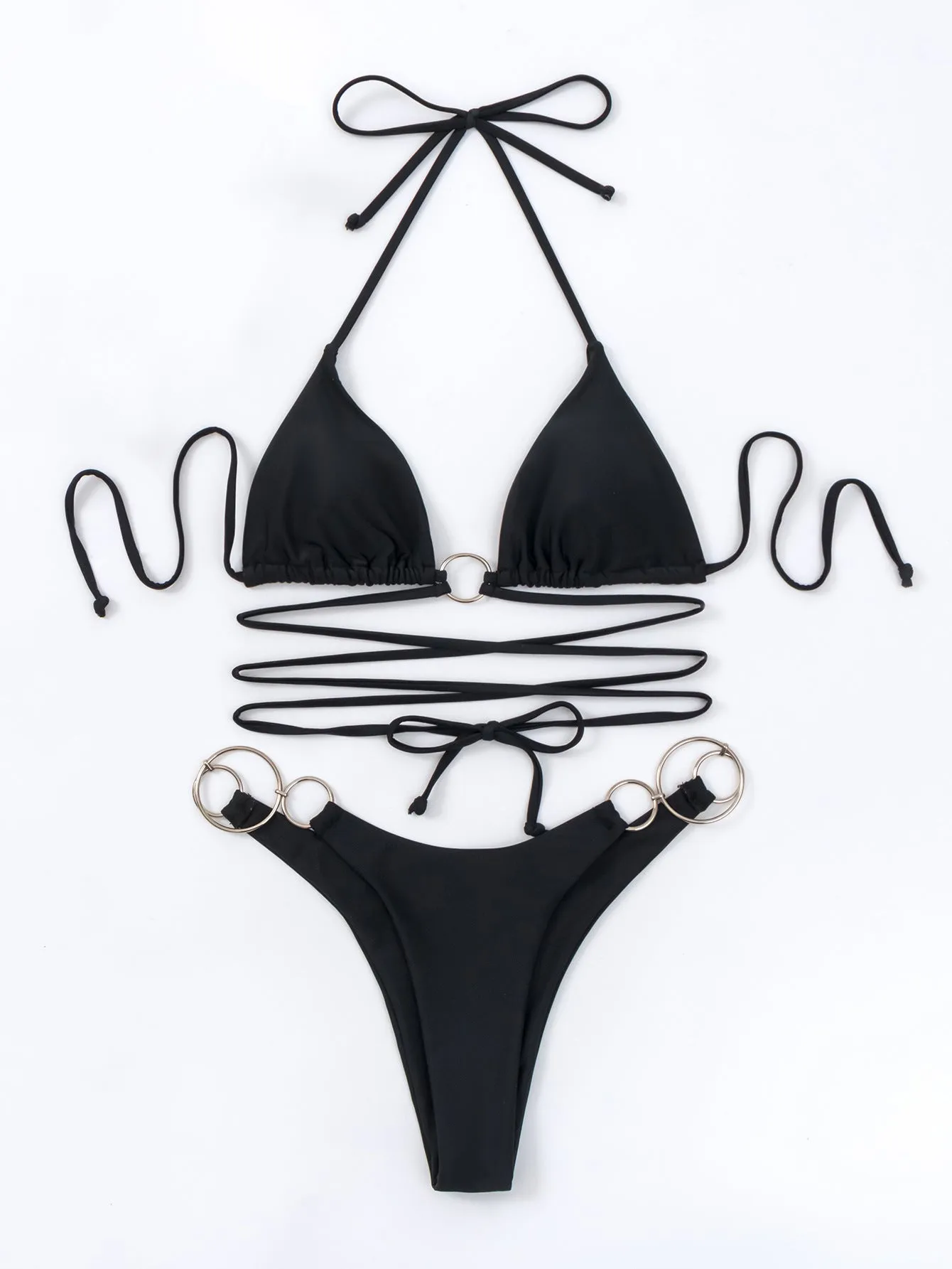 Black women's bikini set with metal ring straps and a backless, split cut design.