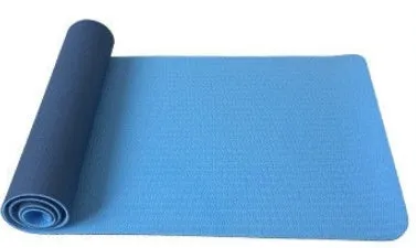 6mm TPE beginner yoga mat in black, rolled on wooden floor with textured non-slip surface visible
