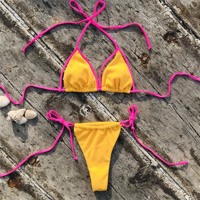 Ladies sports bikini in fluorescent green with chest pad and split beach style, nylon fabric, shown on model