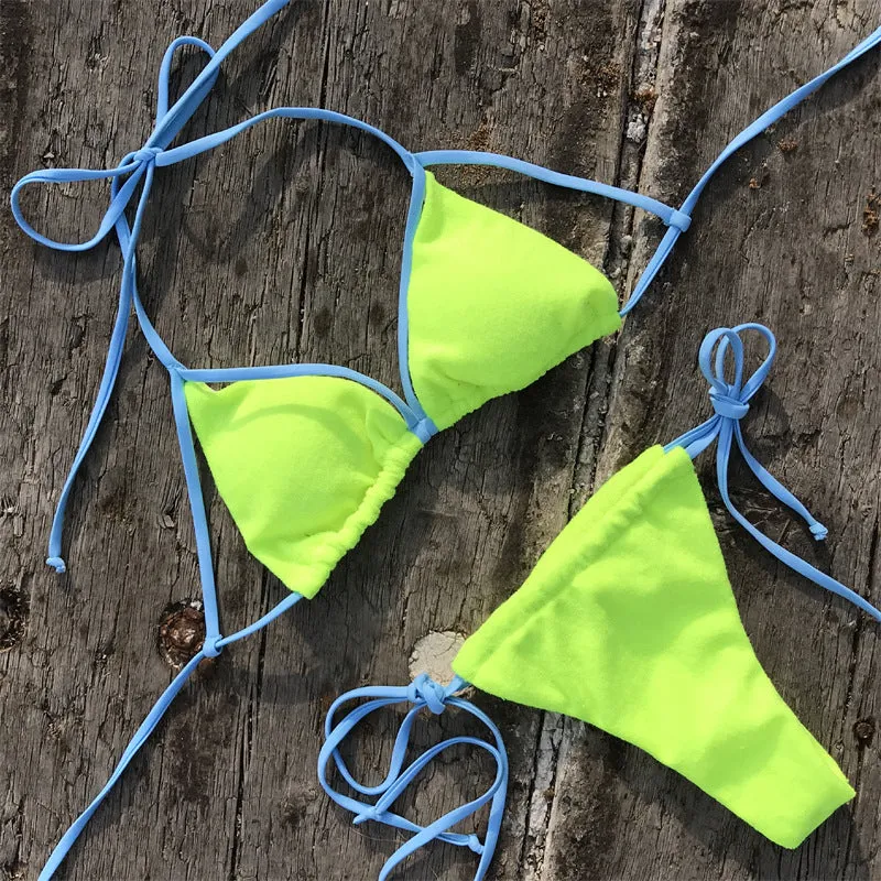 Ladies sports bikini in fluorescent green with chest pad and split beach style, nylon fabric, shown on model