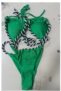 Split triangle bikini with halter neck and lace-up front on woman at beach, black colour option