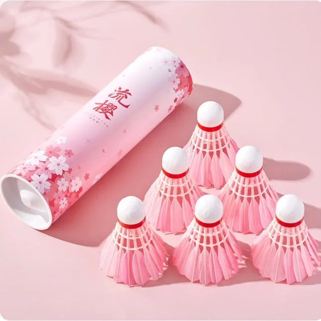 Pink goose feather badminton shuttlecocks in 6 pack on court background
