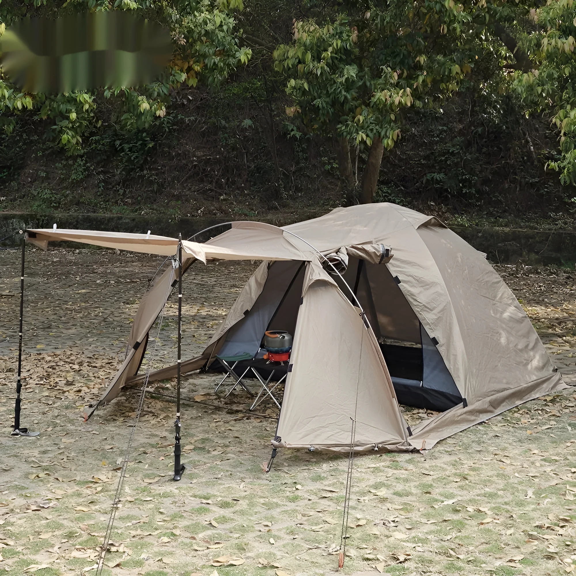 Double occupancy four-season tunnel tent with dome extension, olive green, pitched on grass with external and internal tents visible