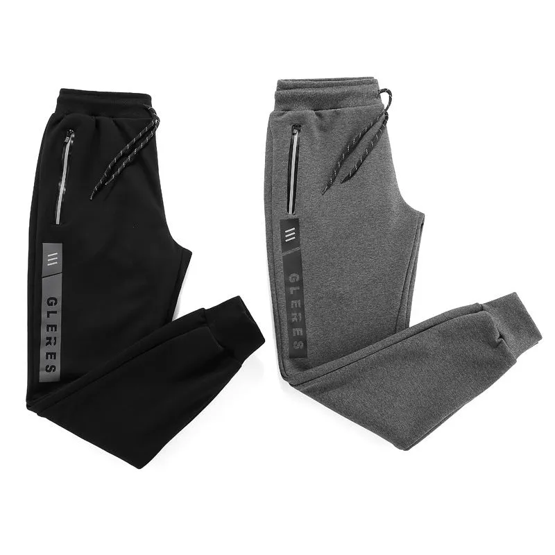 Men's sports casual harem pants in black, side view, with elastic waist and relaxed fit.