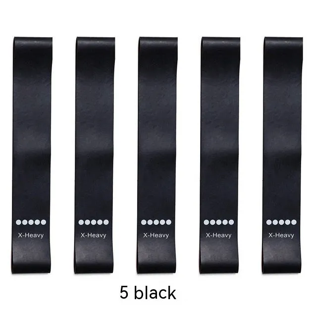 Five colour-coded TPE yoga tension straps with force marks arranged by thickness from 0.5mm to 1.1mm